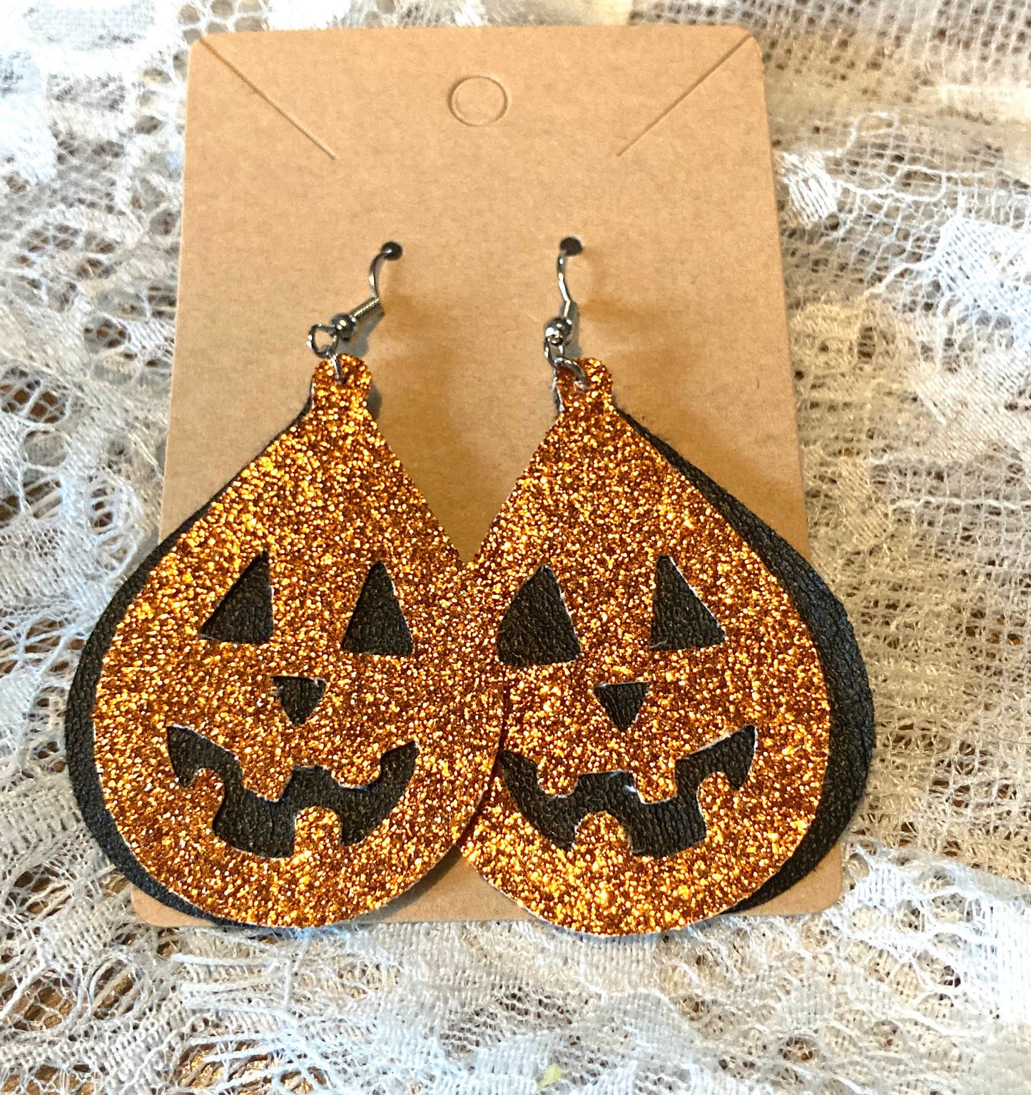 Jack-o-lantern Faux Leather Teardrop Earrings double layer- black under layer with sparkly orange jack o lantern overlay