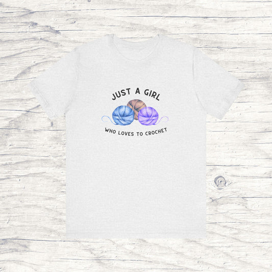 Funny Crochet T-Shirt Just a Girl Who Loves to Crochet Shirt ash colored shirt with black letters and three balls of yarn
