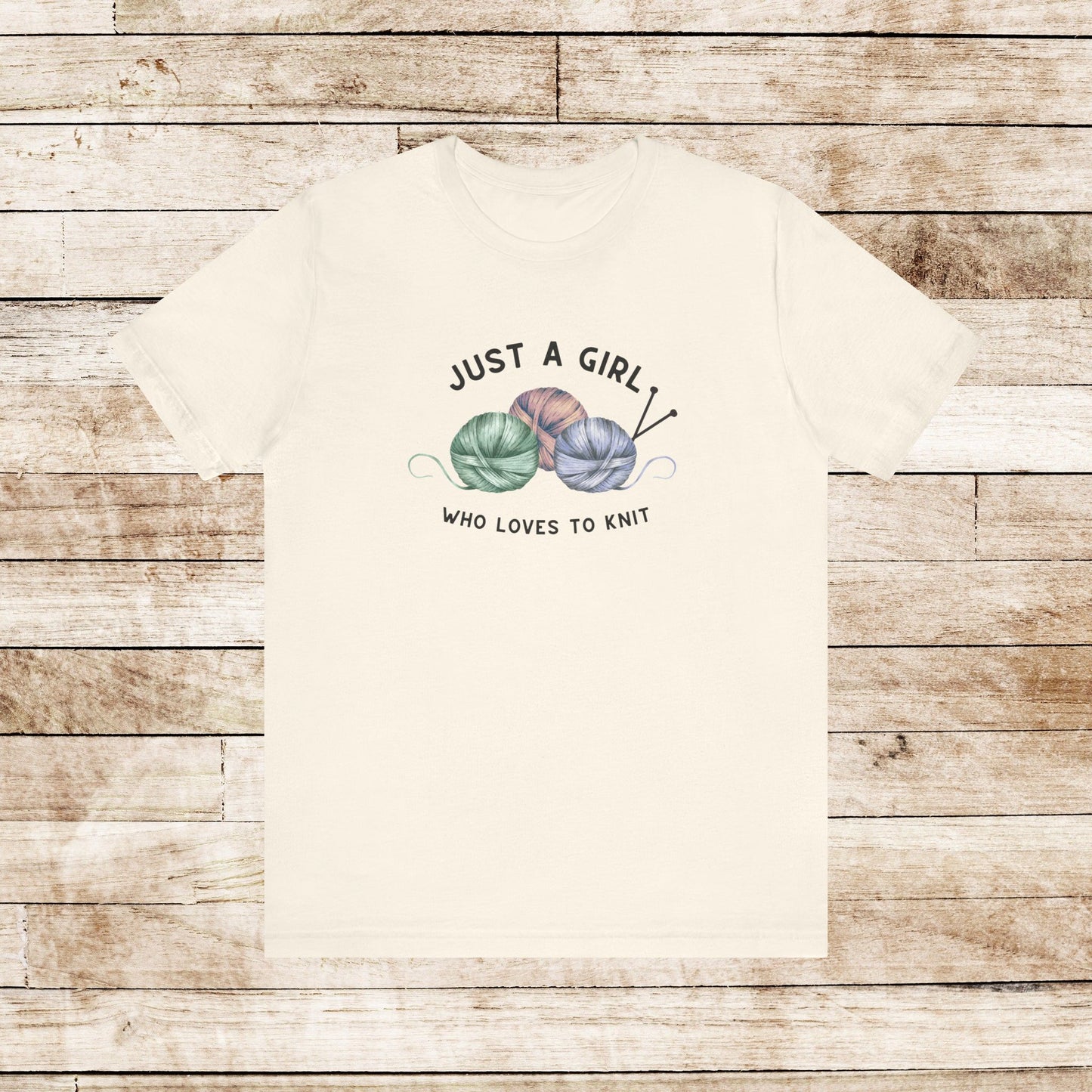 Funny Knitting T-Shirt- Just a Girl Who Loves to Knit, natural color shirt with black letters, 3 balls of yarn with knitting needles