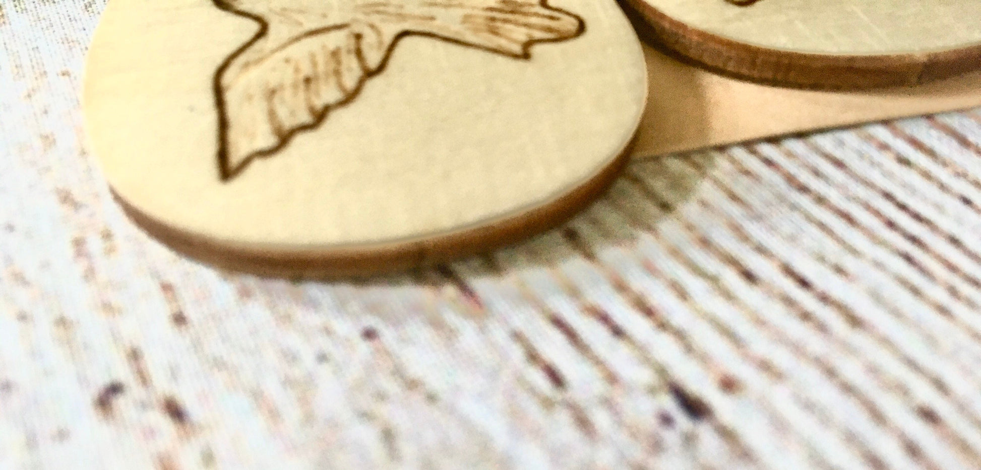 Wood burned earrings with dove bird  flying. Earrings are tear drop shaped with fishhooks.