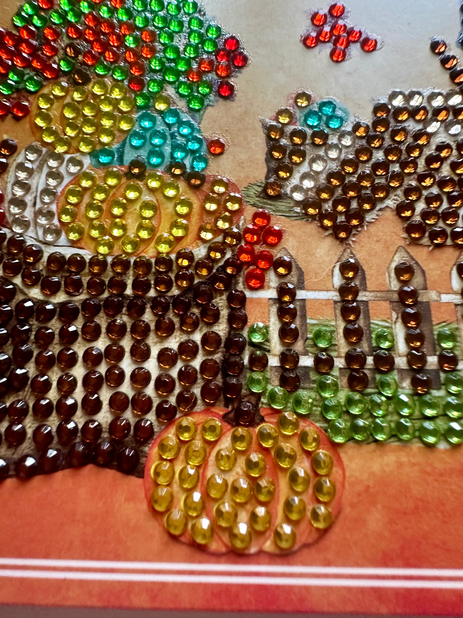 Decorative card with diamond dots forming pumpkins closeup