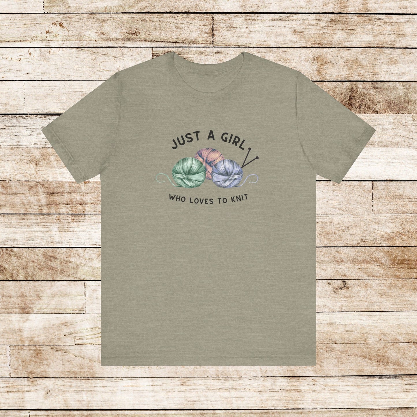 Funny Knitting T-Shirt- Just a Girl Who Loves to Knit, heather stone color shirt with black letters, 3 balls of yarn with knitting needles