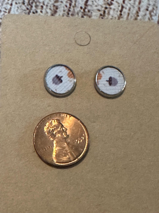 round stud earrings with an acorn faux leather center with penny to show size