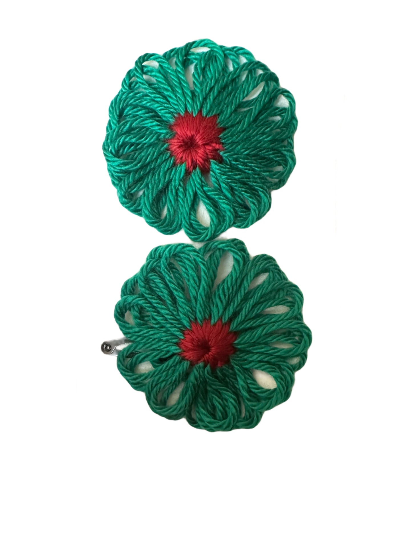 Two green yarn flowers with red centers on a white background
