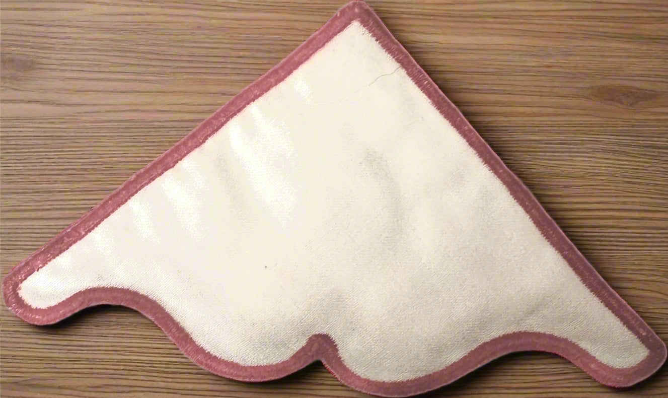 White corner bookmark with red border on a wooden surface