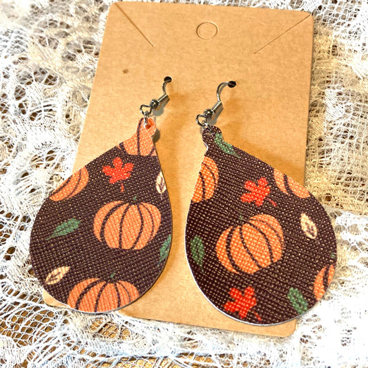 Pumpkin Faux Leather Teardrop Earrings- orange pumpkins, fall colored leaves on brown background