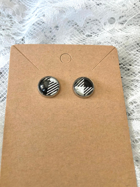 round stud earrings with a black and white buffalo plaid faux leather center