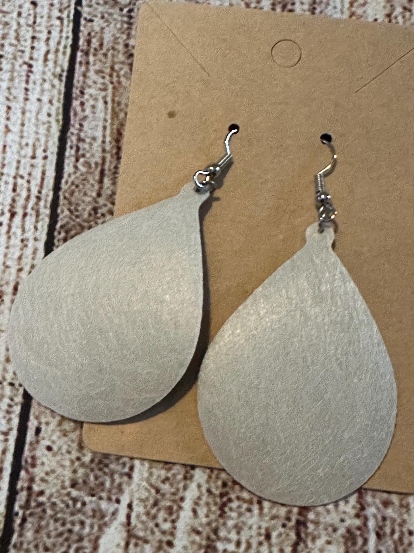 white back of teardrop shaped faux leather earrings