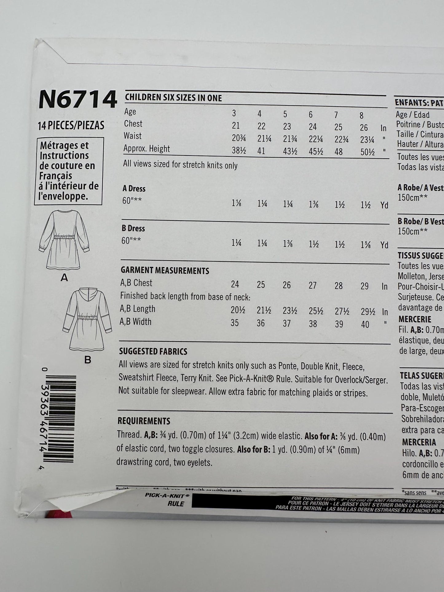 Pattern packaging with garment measurements and fabric requirements for children's dresses.