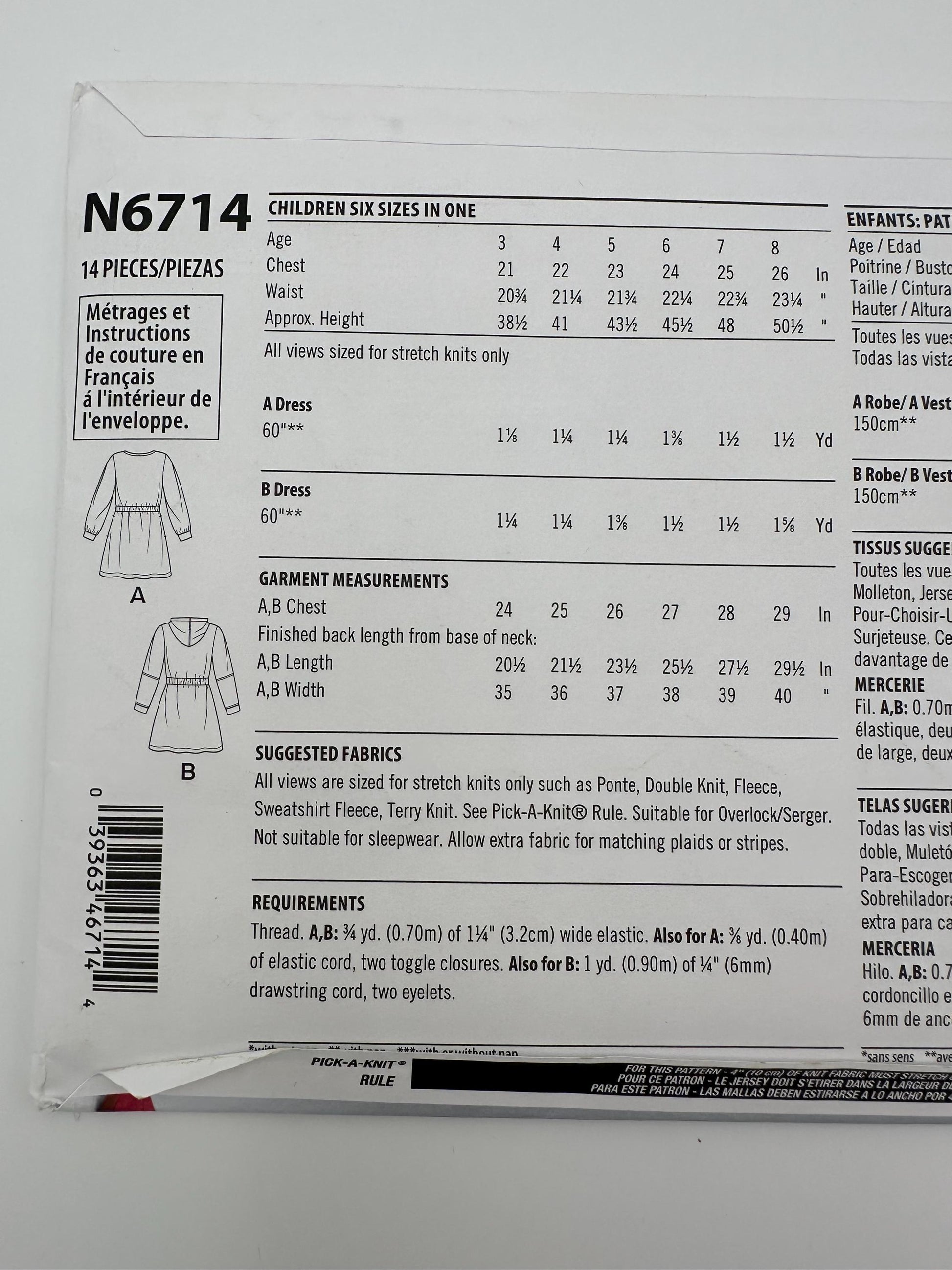 Pattern packaging with garment measurements and fabric requirements for children's dresses.