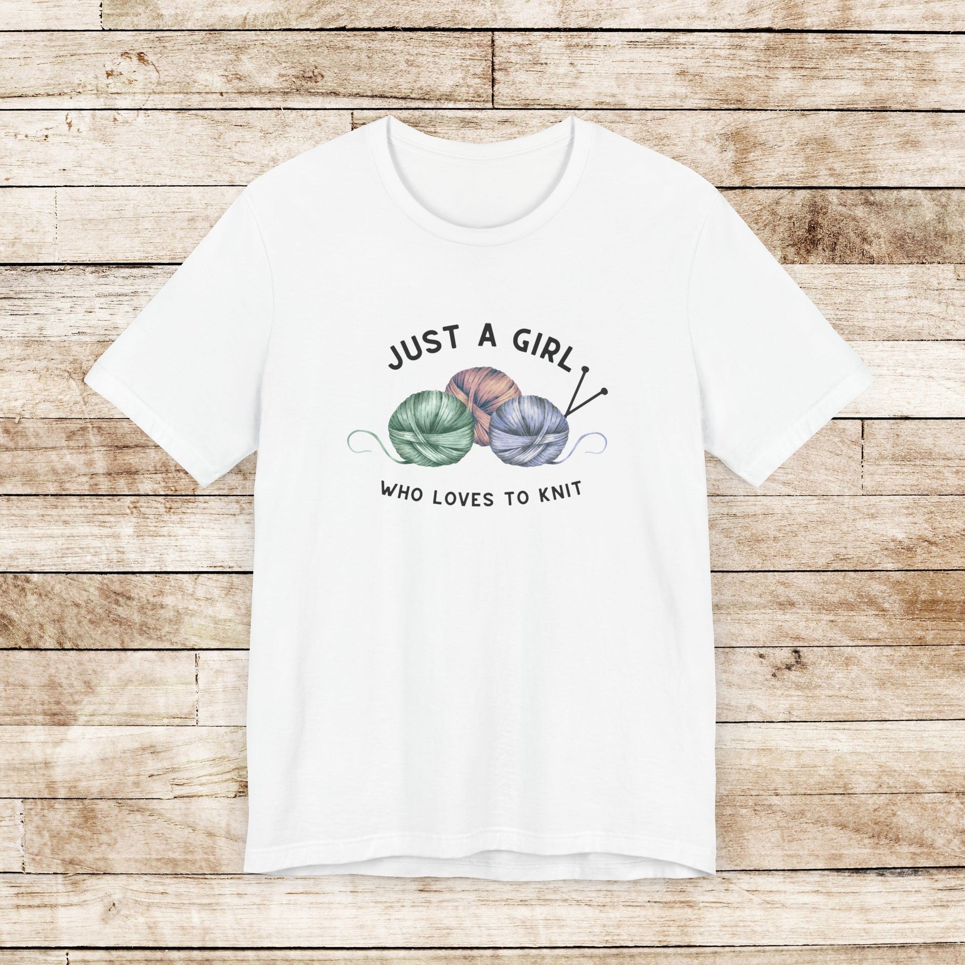 Funny Knitting T-Shirt- Just a Girl Who Loves to Knit, white shirt with black letters, 3 balls of yarn with knitting needles