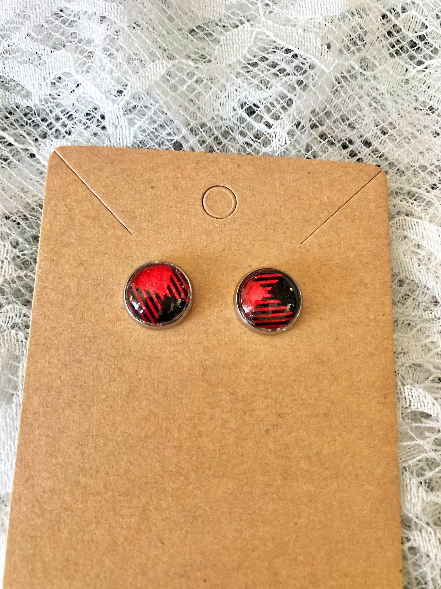 round stud earrings with red and black buffalo plaid faux leather center
