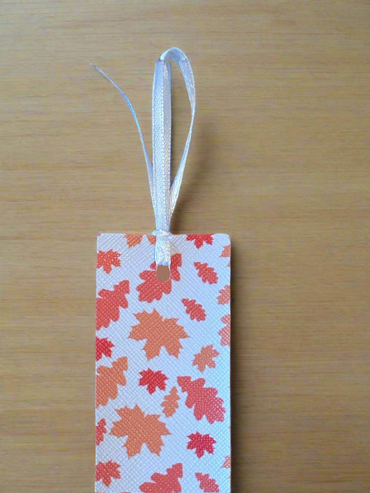 Bookmark with leaf pattern on a wooden surface