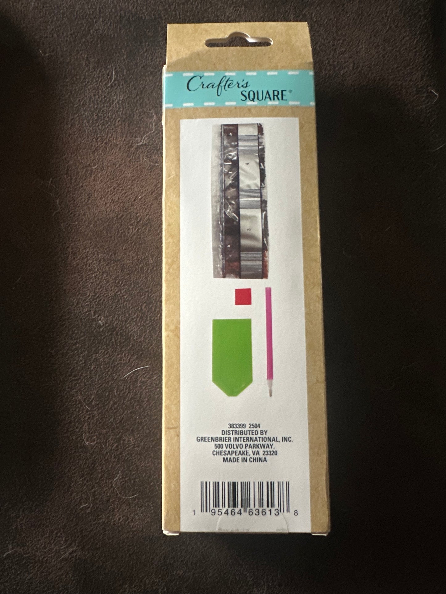 Cardboard packaging with a label on a dark surface